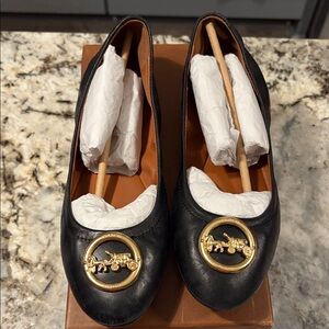 Coach Black Leather Ballet Flats with Gold Medallion logo